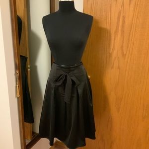 Midi-length Black Satin Skirt with Front Bow Detail